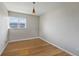Standard bedroom with laminate flooring and single window for natural light at 1573 S Dexter Way, Denver, CO 80222