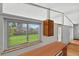 Bright kitchen featuring large windows with a view of the green lawn at 1573 S Dexter Way, Denver, CO 80222