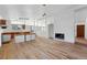 Living room featuring hardwood floors, a fireplace, and a bright and airy space at 1573 S Dexter Way, Denver, CO 80222