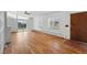 Spacious living room with hardwood floors, large windows and a sliding door at 1573 S Dexter Way, Denver, CO 80222