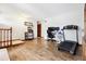 Comfortable living room featuring wood floors, a neutral color palette, and ample space at 6718 Ingalls Ct, Arvada, CO 80003