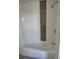 Clean and renovated bathroom featuring a modern bathtub and tile, enhancing comfort at 3241 E 84Th Dr, Thornton, CO 80229