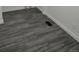 Close up on wood-look flooring with white trim and electrical outlet at 3241 E 84Th Dr, Thornton, CO 80229