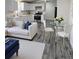 Cozy living room and kitchen with new appliances and modern finishes; ideal open-concept design at 3241 E 84Th Dr, Thornton, CO 80229