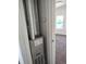 Furnace in closet near a carpeted bedroom with a window to the outside at 3241 E 84Th Dr, Thornton, CO 80229