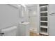 Clean basement bathroom with shower, vanity, and shelving at 6441 S Eudora Way, Centennial, CO 80121