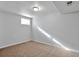 Bright basement bedroom featuring neutral walls and carpet at 6441 S Eudora Way, Centennial, CO 80121