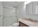 Updated bathroom with a walk-in shower and granite vanity at 6441 S Eudora Way, Centennial, CO 80121