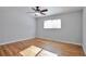 Bedroom with hardwood floors, ceiling fan and large window at 6441 S Eudora Way, Centennial, CO 80121