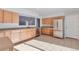 Kitchen with light wood cabinets, stainless steel appliances, and tile floors at 6441 S Eudora Way, Centennial, CO 80121