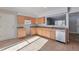 Bright kitchen features ample cabinetry and tile flooring at 6441 S Eudora Way, Centennial, CO 80121