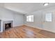 Bright living room features hardwood floors, fireplace and lots of natural light at 6441 S Eudora Way, Centennial, CO 80121