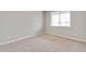 Cozy bedroom with carpeted floors, a window, and fresh paint at 840 Leeward St, Lochbuie, CO 80603