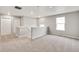 Large bonus room with neutral carpet, fresh paint and natural light at 840 Leeward St, Lochbuie, CO 80603