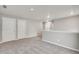 Bonus room with neutral carpet, fresh paint, doors, and natural light at 840 Leeward St, Lochbuie, CO 80603