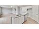 Kitchen island with stainless steel dishwasher and granite countertops at 840 Leeward St, Lochbuie, CO 80603