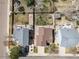 An aerial view of a residential area with well-maintained lawns and houses on a sunny day, highlighting the neighborhood layout at 5189 S Malta Way, Centennial, CO 80015