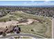 Picturesque aerial view of the neighborhood park surrounded by homes with mountain views in the distance at 5189 S Malta Way, Centennial, CO 80015