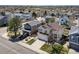 Stunning aerial view of a home with a well-manicured lawn, a black SUV, and a spacious driveway at 5189 S Malta Way, Centennial, CO 80015