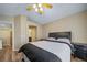 Comfortable bedroom features a ceiling fan and view of the bathroom at 5189 S Malta Way, Centennial, CO 80015