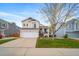 Charming two-story home with a well-maintained front lawn, inviting porch, and attached two-car garage at 5189 S Malta Way, Centennial, CO 80015