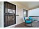 Inviting front porch with secure door, open seating, and space for outdoor enjoyment at 5189 S Malta Way, Centennial, CO 80015