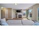Cozy living room with a fireplace, built-in shelves, and access to the outdoor space at 5189 S Malta Way, Centennial, CO 80015
