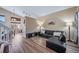 Comfortable living room featuring hard floors, bright lighting, and seamless flow to the dining area at 5189 S Malta Way, Centennial, CO 80015