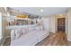 Spacious living room with a large sectional couch, open staircase, and kitchen views at 5189 S Malta Way, Centennial, CO 80015