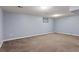 Expansive carpeted basement space offering versatility for a variety of uses at 6711 S Race St, Centennial, CO 80122