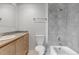 This bathroom has a shower and tub combination with a single sink vanity at 6711 S Race St, Centennial, CO 80122
