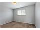 This bedroom features carpeted floors, a window and neutral walls at 6711 S Race St, Centennial, CO 80122
