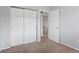 A bedroom with carpeted floors and neutral walls at 6711 S Race St, Centennial, CO 80122