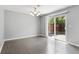 Dining space with new flooring, sliding doors to the patio, and a chandelier at 6711 S Race St, Centennial, CO 80122