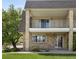 Charming two-story condo with brick facade and a covered balcony, perfect for outdoor relaxation at 6711 S Race St, Centennial, CO 80122