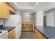 Well-organized kitchen leading to a storage area with shelving and drawers at 6711 S Race St, Centennial, CO 80122