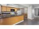 Practical kitchen design with a breakfast bar, white appliances, and ample storage at 6711 S Race St, Centennial, CO 80122