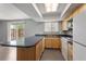 Contemporary kitchen with a view of the backyard from a kitchen sink window at 6711 S Race St, Centennial, CO 80122