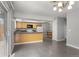 Updated kitchen with new flooring, a kitchen sink window, and view of the dining room at 6711 S Race St, Centennial, CO 80122