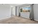 Spacious living area with a large window and a view of the entryway door at 6711 S Race St, Centennial, CO 80122