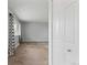 Bright living room showcasing neutral tones, a large window, and a closet at 6711 S Race St, Centennial, CO 80122