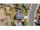Aerial view of the property showcasing the well-maintained backyard, lush lawn, and proximity to the street at 5324 S Malta Way, Centennial, CO 80015