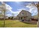 Spacious backyard with a well-maintained lawn, a storage shed, and a patio area for outdoor enjoyment at 5324 S Malta Way, Centennial, CO 80015