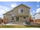 View of the home's back exterior featuring a cozy patio area, perfect for enjoying the outdoors at 5324 S Malta Way, Centennial, CO 80015