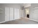Neutral bedroom featuring multiple closets and an ensuite bathroom doorway for added convenience at 5324 S Malta Way, Centennial, CO 80015