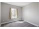Carpeted bedroom with a window showcasing natural light with white painted walls and trim at 5324 S Malta Way, Centennial, CO 80015