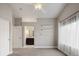 Bedroom offering neutral paint, an ensuite bathroom doorway, carpet, and built-in shelving accents at 5324 S Malta Way, Centennial, CO 80015