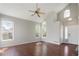 Bright and airy living room featuring vaulted ceilings, large windows, and hardwood floors, providing a welcoming atmosphere at 5324 S Malta Way, Centennial, CO 80015