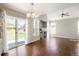 Bright living room features hardwood floors, fireplace, vaulted ceilings, and large sliding doors to the backyard at 5324 S Malta Way, Centennial, CO 80015