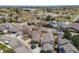 A residential neighborhood with tree-lined streets and well-maintained homes in close proximity to a lake at 10436 W 84Th Pl, Arvada, CO 80005